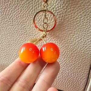 flame ombre cherry bag charm nip